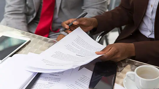 people holding documents